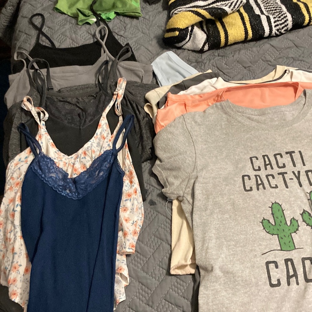 6 spaghetti strap tops, one shoulder baby blue crop top, and 6 random tees💜